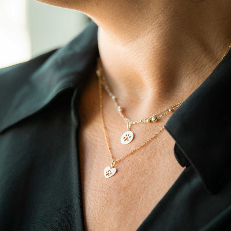 Anheng i gull Poten hjerte